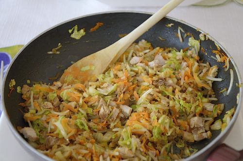 Fried cabbage, carrot, bean sprouts for egg roll filling.