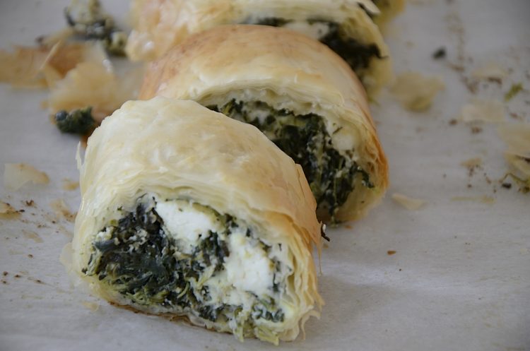 Slices of flaky phyllo filled with spinach and feta cheese.