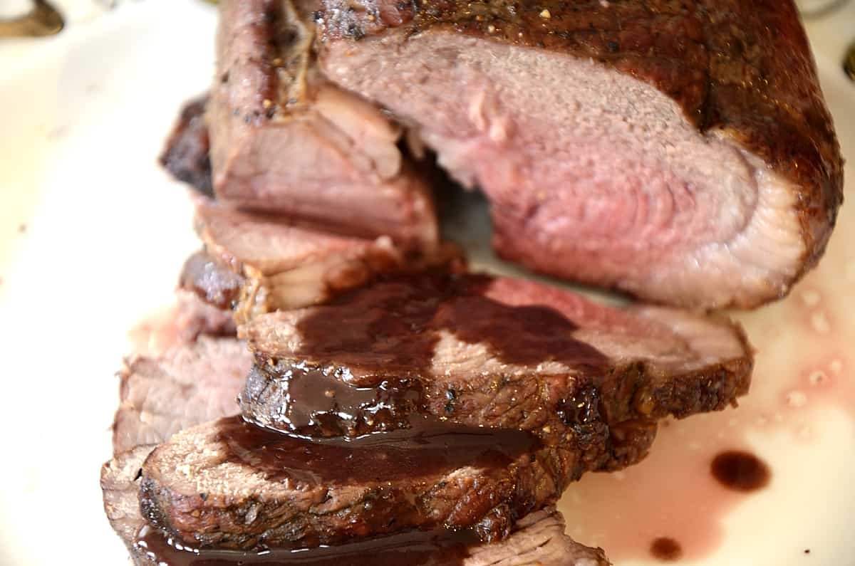 Top sirloin roast beef  drizzled with Bordelaise Sauce.