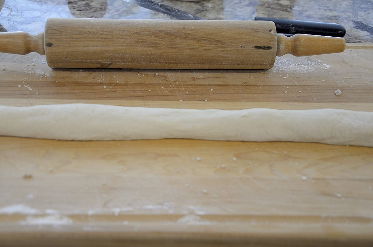 Dough rolled for caramel cruffins.