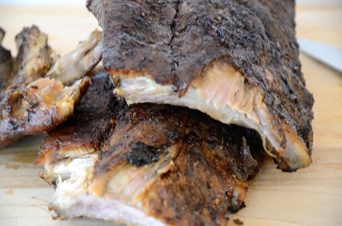 Cut rack of pork back ribs with dry spice rub and balsamic glaze.