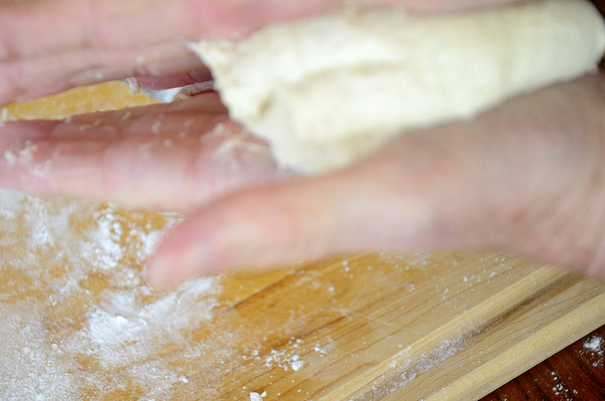 Hand kneading 72 Hour Pizza Dough balls.