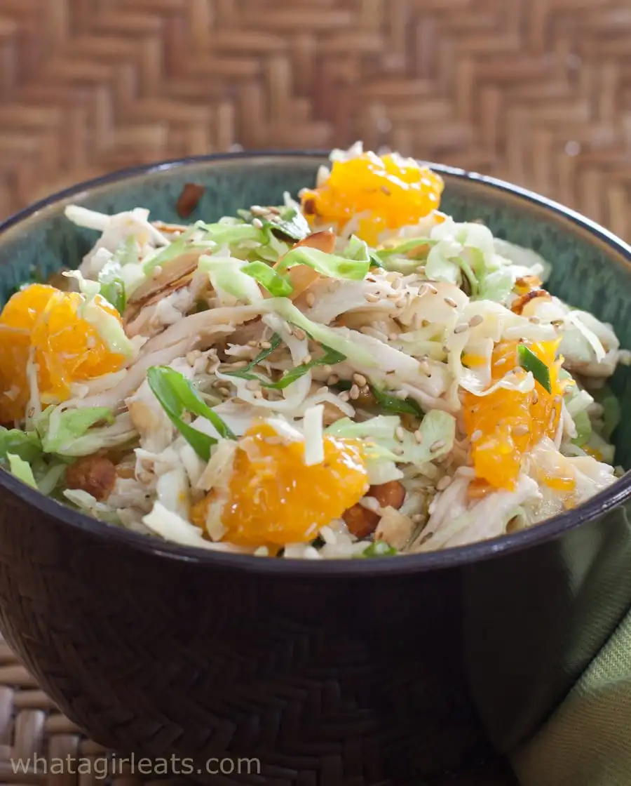 Chicken, mandarins and napa cabbage salad in a bowl.