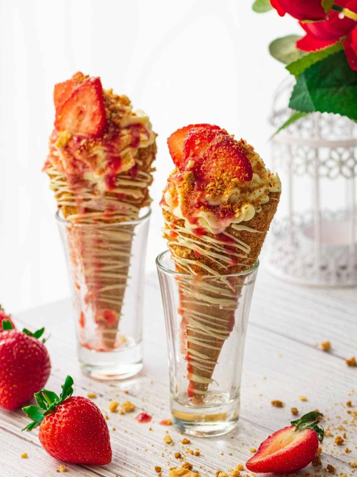 Waffle cones filled with strawberry cream cheese ice cream and home made strawberry jam.