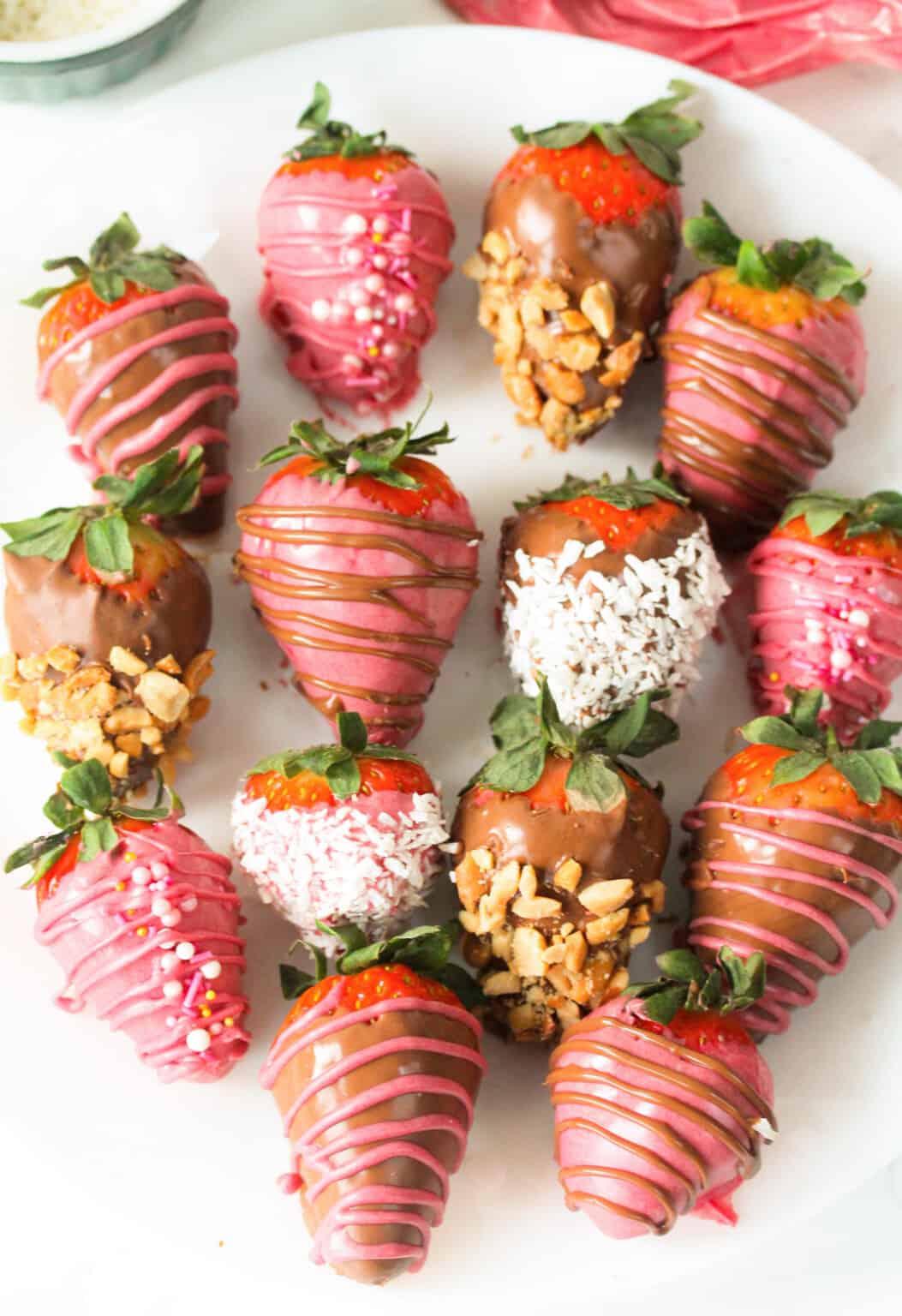 Strawberries dipped in chocolate and drizzled with more chocolate or sprinkles.