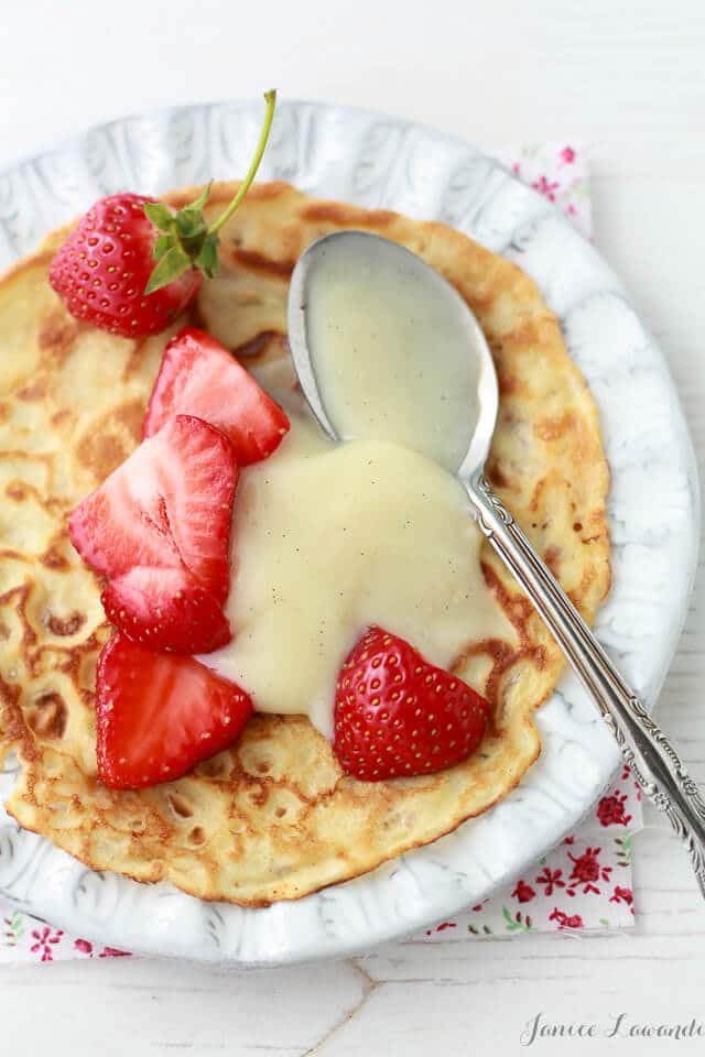 Crepes with fresh strawberry slices and vanilla pastry cream.