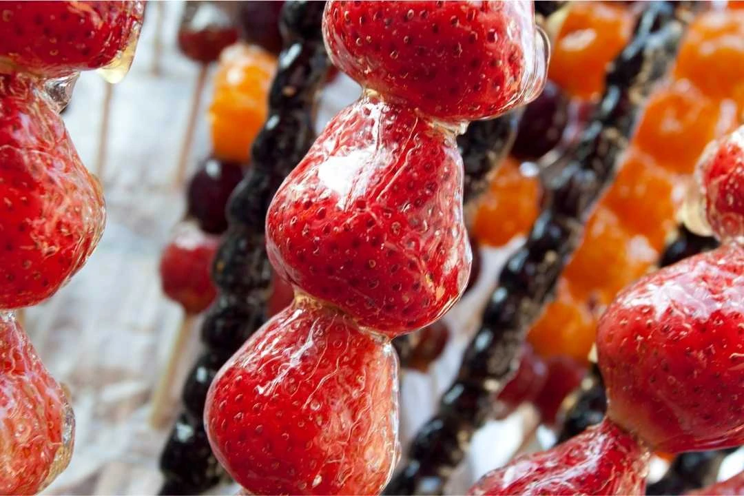 candied strawberries on a skewer.