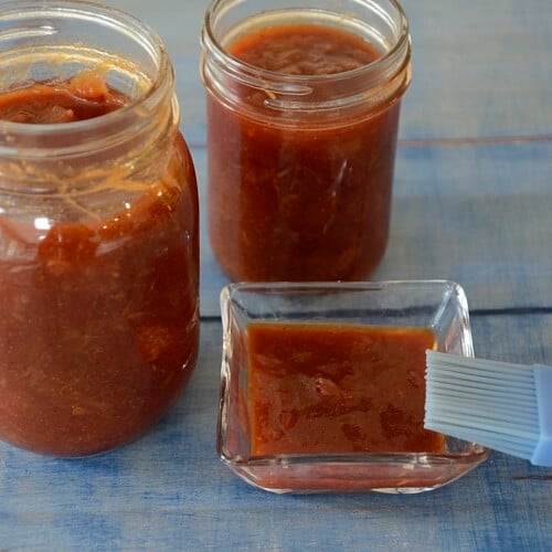 Ruby red rhubarb/strawberry BBQ sauce in mason jars.