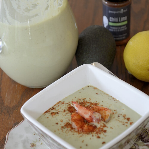 Chilled avocado soup with lobster and chili lime seasoning garnish.