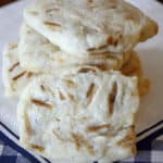 Toasted almond butter cookies stacked.