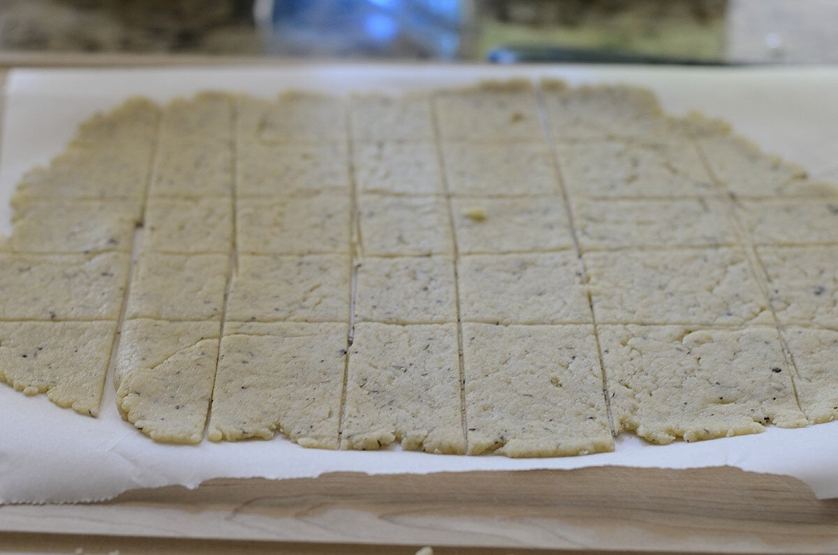 Champagne crackers, scored, ready to bake.