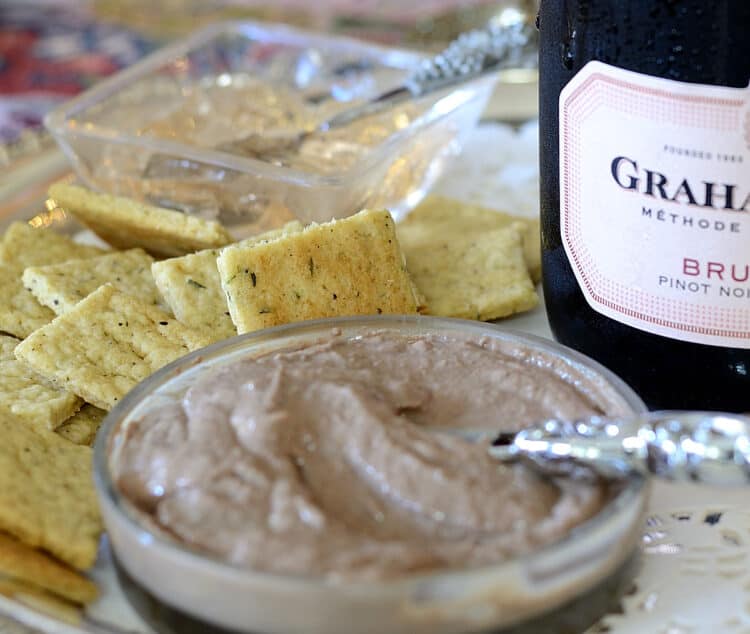 Close up of a dish of Champagne Pate with Champagne Crackers beside.