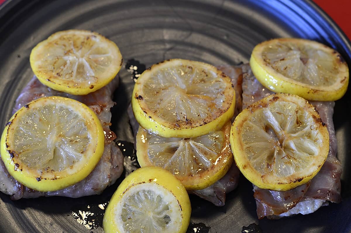 Caramelized lemon slices on pork scaloppini.