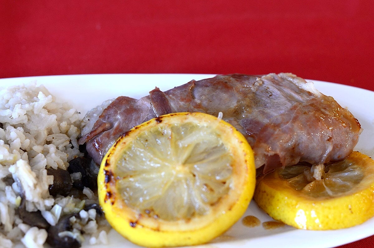 Pork scaloppini with caramelized lemon slices beside Mushroom Risotto with Vermouth.