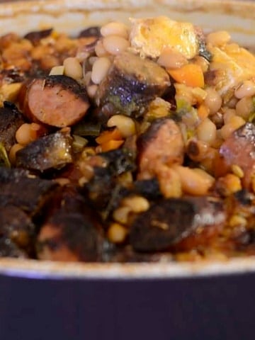 Close up of cassoulet casserole with deep browned topped.