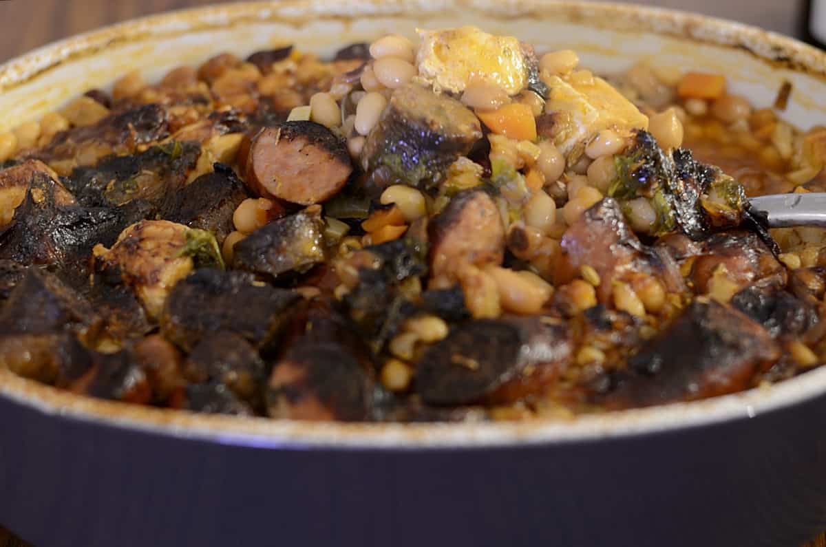 Close up of cassoulet casserole with deep browned topped.