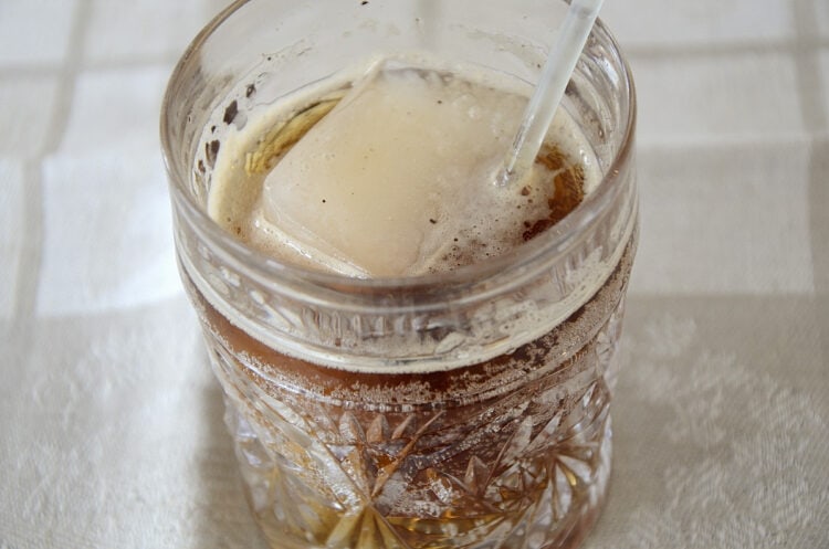 Fizzy, refreshing drink made with soda water, balsamic vinegar and maple syrup poured over ice.