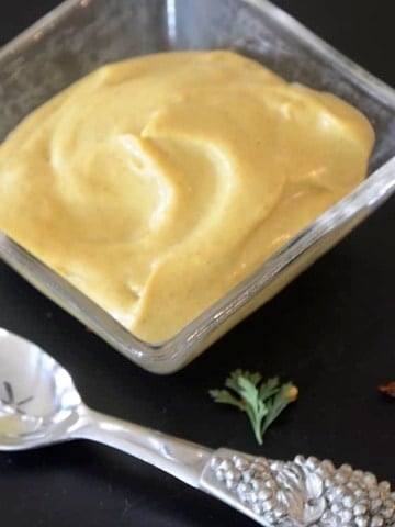 Small dish of Curry Mustard Mayonnaise Sauce.