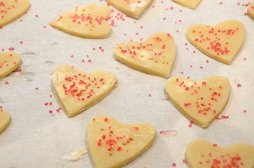 Heart shaped cream wafer cookies ready for the oven.