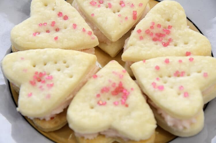 Heart shaped Tea Time Champagne Cream wafers on a plate with Champagne Jelly flavoured icing.