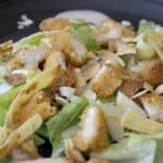 Copy Cat Applebee's Chicken Tenders Salad with toasted almonds, crunchy cabbage and chow mein noodles over a bed of lettuce.
