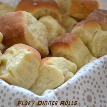 Dinner rolls in a bread basket.