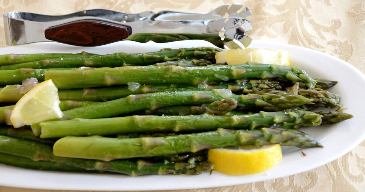 Oven roasted asparagus on a serving plate.